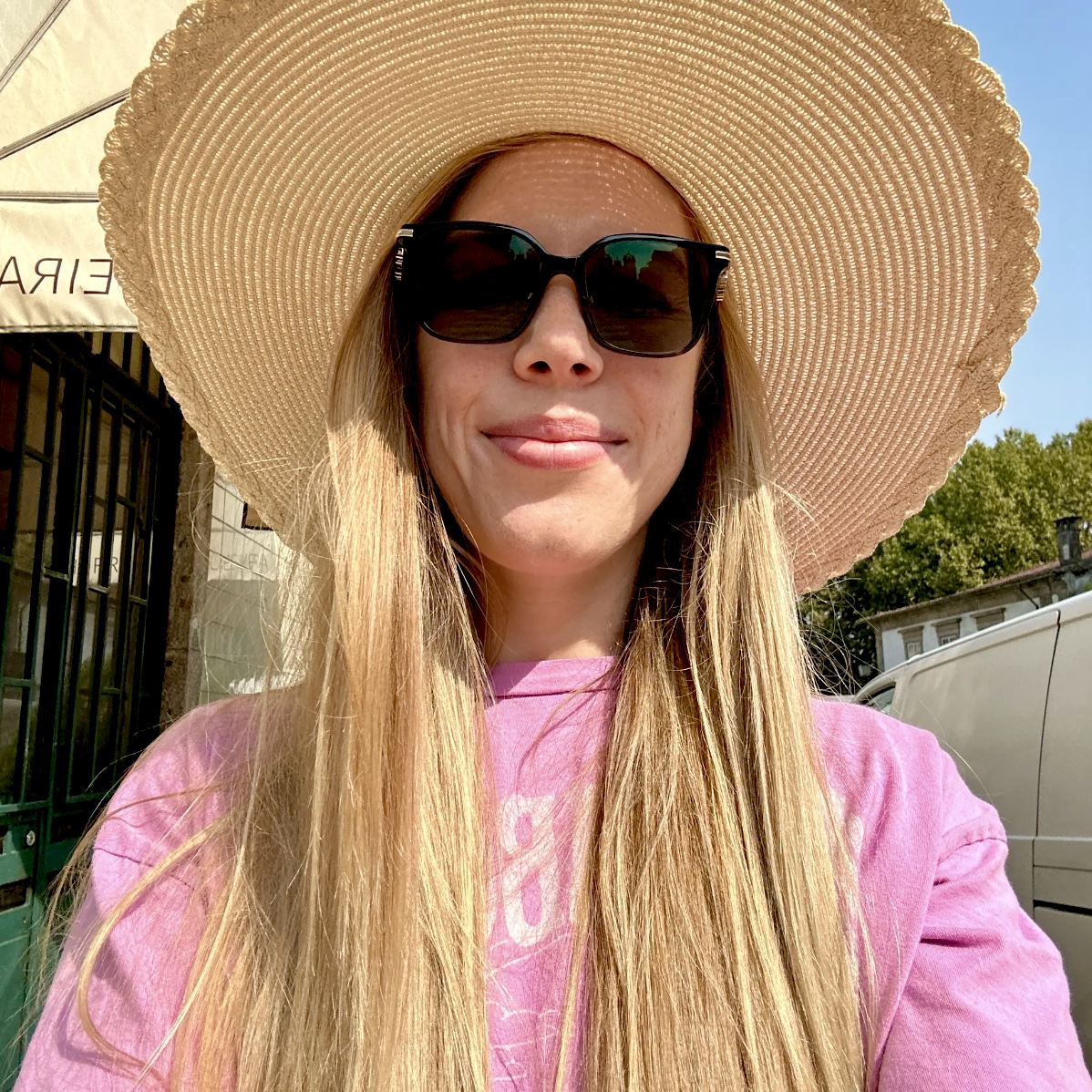 Marta Ustīnova in a straw sun hat